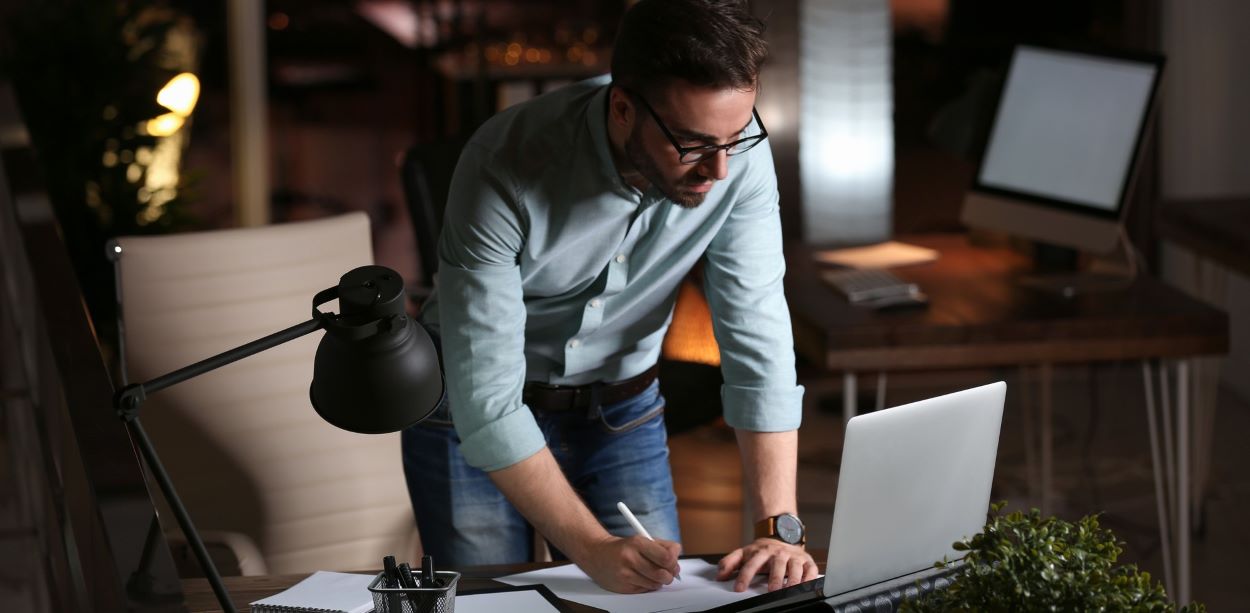 photo of an insurance tech investigator, researching and reviewing social media accounts for an insurance claim