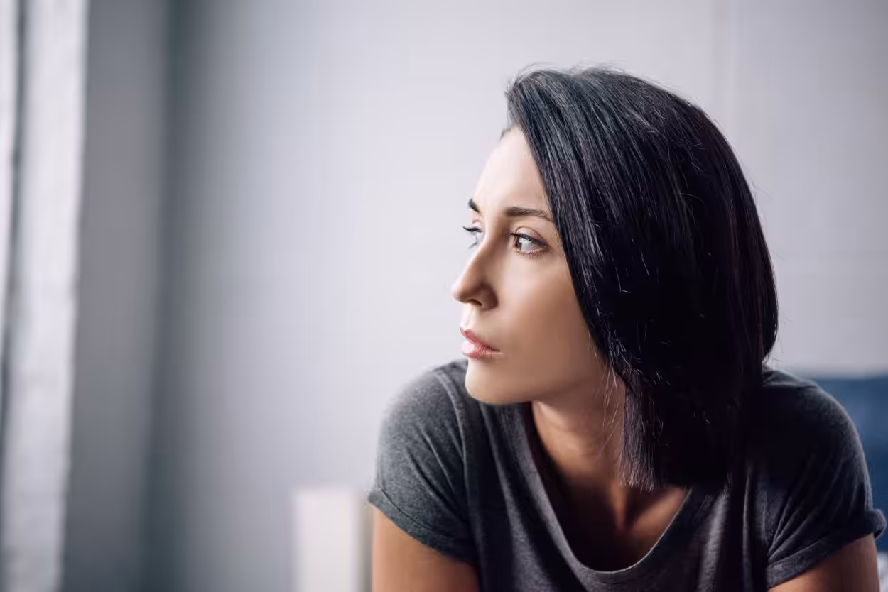 image of an upset female, struggling with anxiety and PTSD after a car accident experience